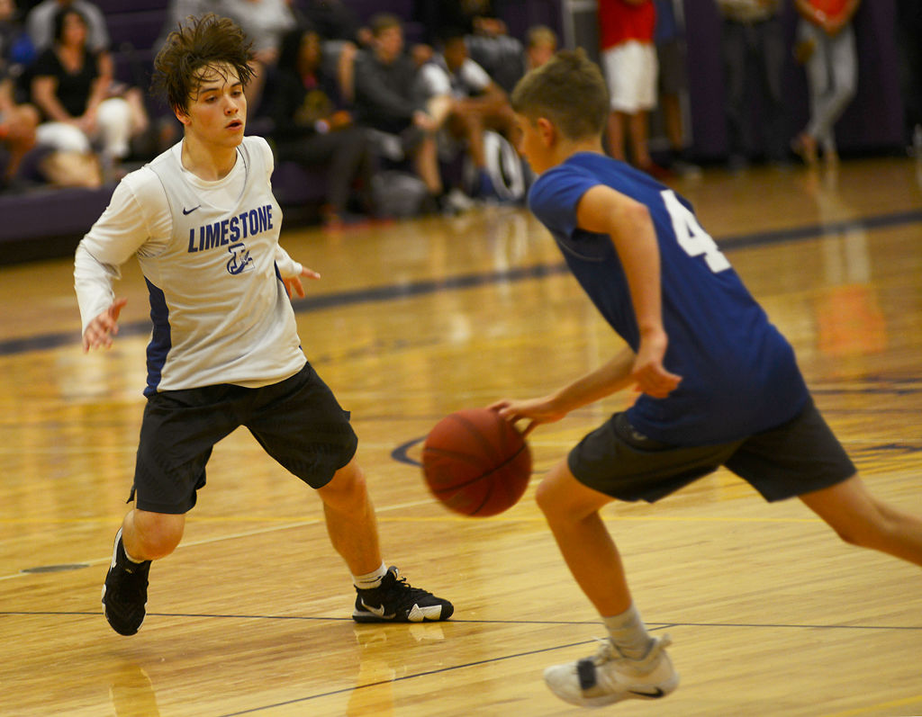 Limestone Community High School point guard Drew Taggart defends a Montgomery County player